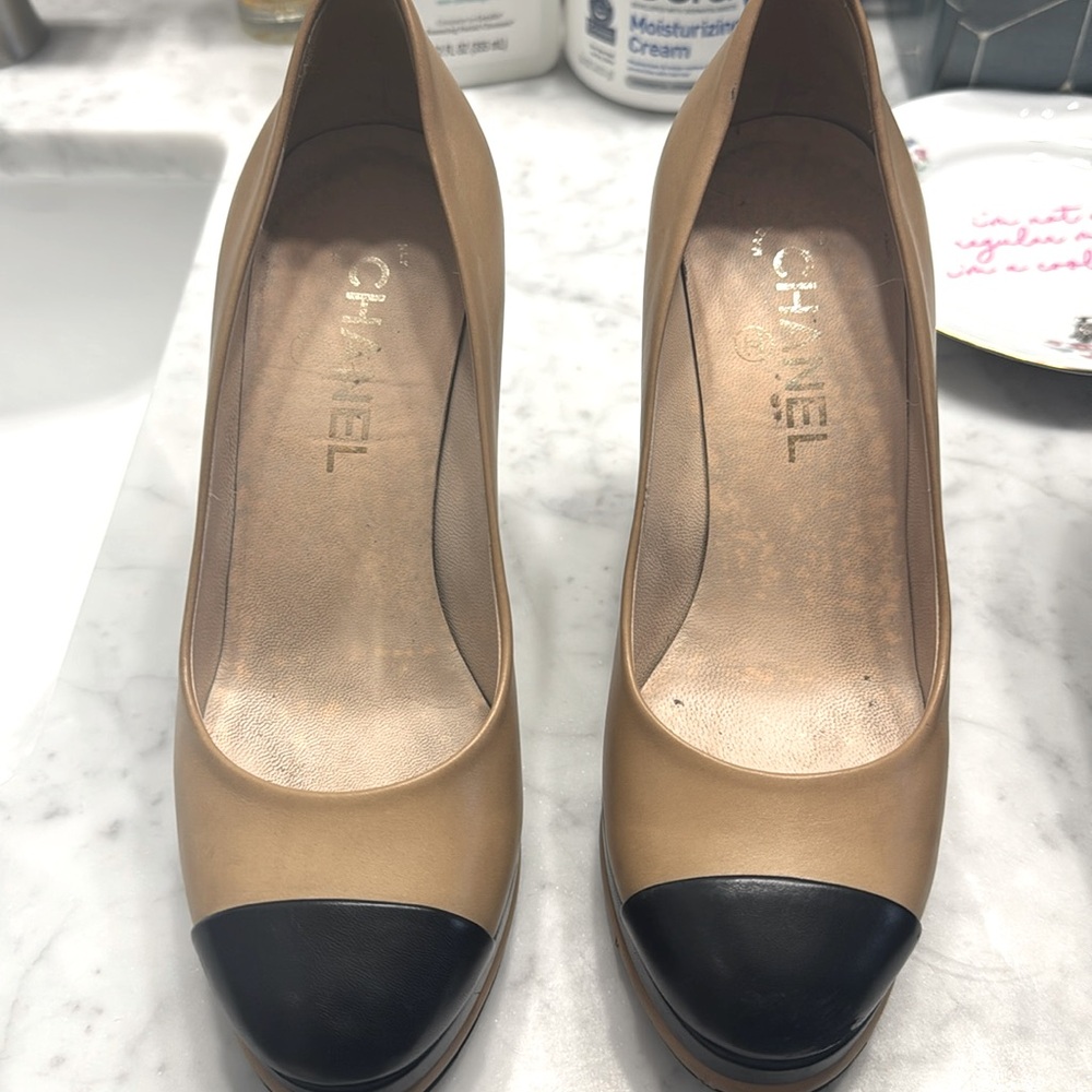 Chanel tan and black pumps